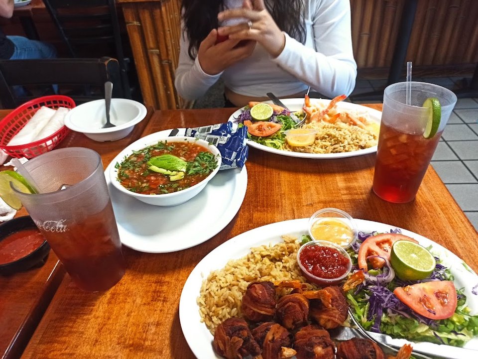 Printed menu with seafood and Mexican dishes.